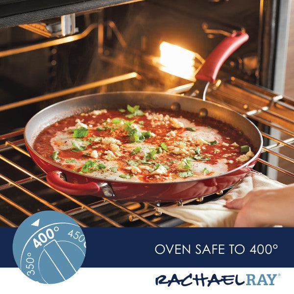 The Cook + Create Nonstick Frying Pan, crafted from thicker gauge aluminum, is a high-performance red pan that is oven safe up to 400 degrees.