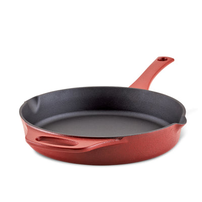 Red cast iron skillet with a handle on a white background.