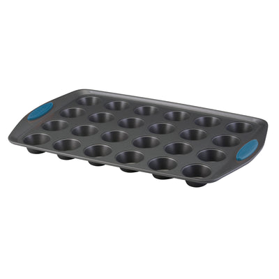 A 24-cup nonstick mini muffin pan with blue silicone handles.