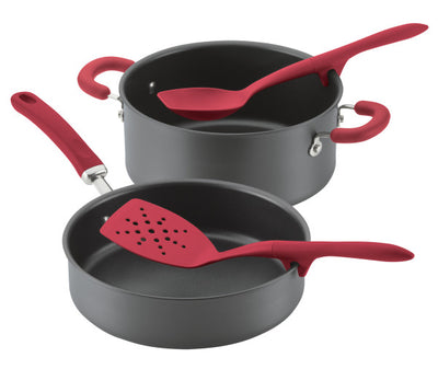 Nonstick pots and pans with red handles and matching red kitchen utensils.