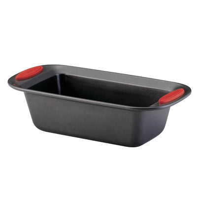 Black loaf pan with red silicone grips on the handles.