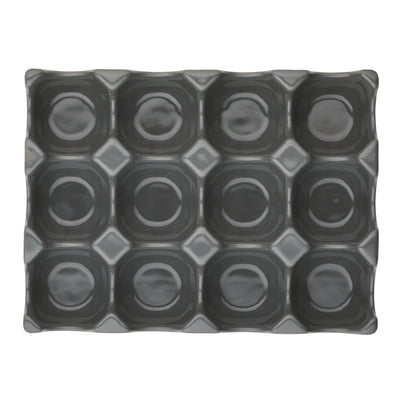 Rectangular ceramic tray with a grid pattern of circular indents.