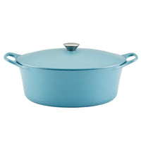 Blue cast iron dutch oven with lid and two handles.