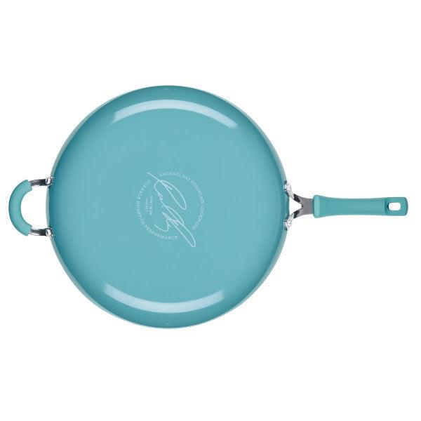 Cook + Create Nonstick Frying Pan in teal, designed with a thicker gauge aluminum for enhanced durability and featuring a handle, shown from an aerial perspective.