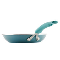 A premium turquoise Cook + Create Nonstick Frying Pan with a matching handle, crafted from thicker gauge aluminum, viewed from the side.