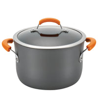 Large gray cooking pot with orange handles and a glass lid.