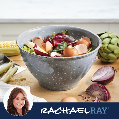 A bowl with vegetable scraps and eggshells on a kitchen counter.