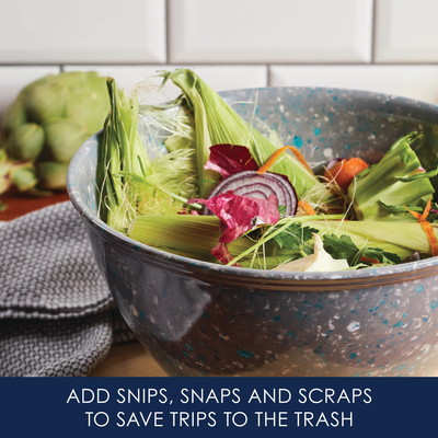 Bowl of vegetable scraps on a kitchen counter with a blue text strip below.