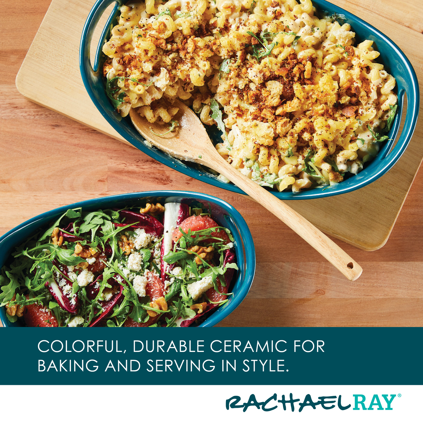 Two ceramic dishes: one with pasta bake, one with salad, and a wooden spoon.