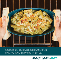 Hands placing a ceramic dish with baked pasta into an oven.