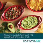Red ceramic dishes with salsa and guacamole, avocado, cilantro, and tortilla chips.