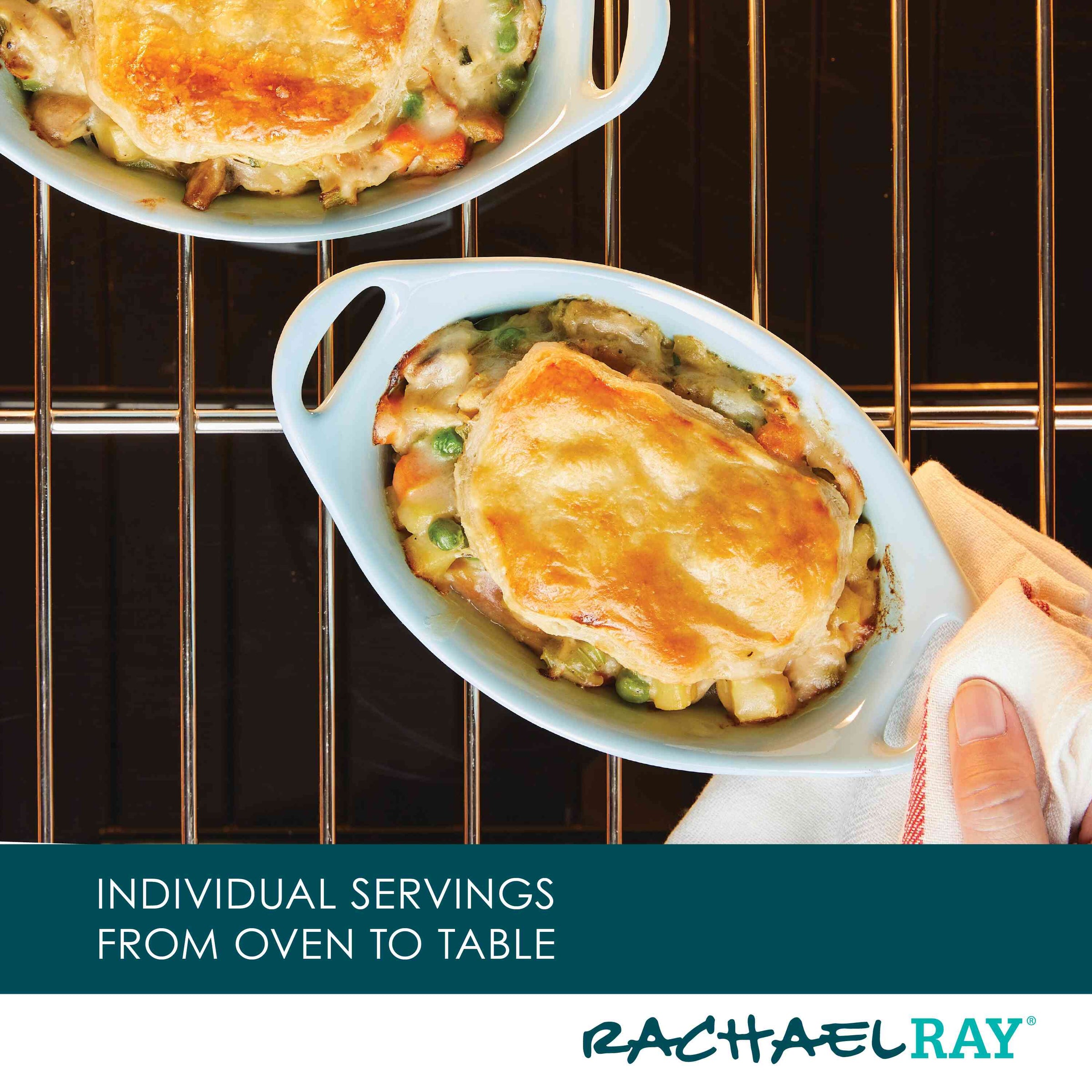 Two small casseroles with golden crusts on an oven rack.