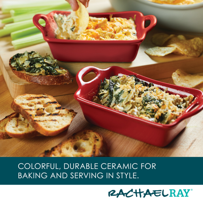 Red ceramic dishes with baked spinach dip and toasted bread slices.