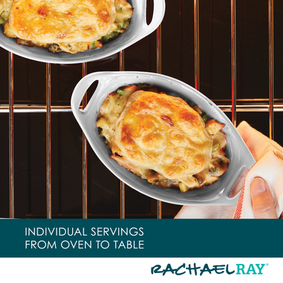 Individual gratin dishes baking in an oven, one being removed with a mitt.