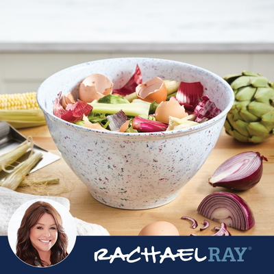 Bowl with vegetable scraps and eggshells on a kitchen counter.