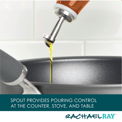 Oil being poured into a frying pan from a bottle with a spout.