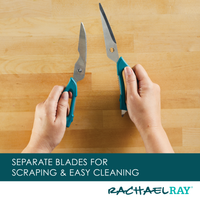 Hands holding separated kitchen shears over a wooden surface.