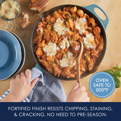 Person stirring pasta dish in a skillet; features oven-safe label.