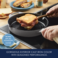 Person making grilled cheese in a cast iron pan on a stovetop.