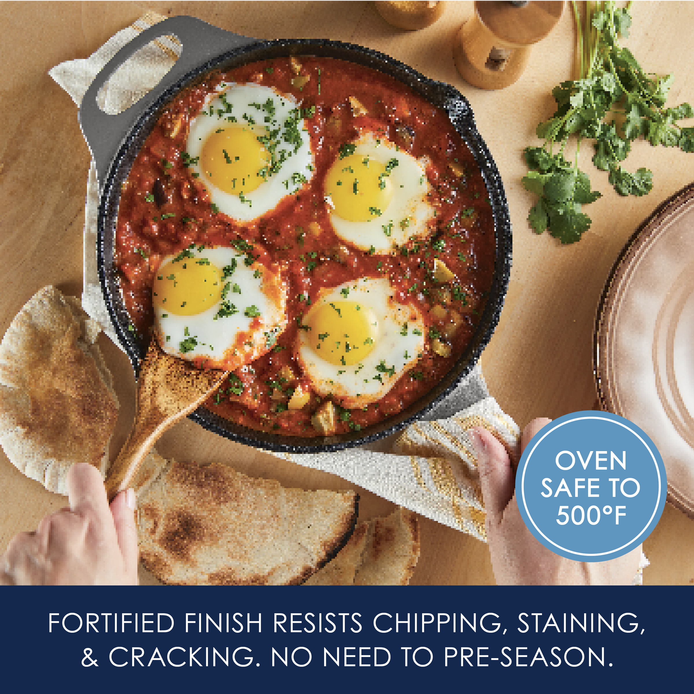 Skillet with baked eggs and herbs in tomato sauce, held over flatbread.