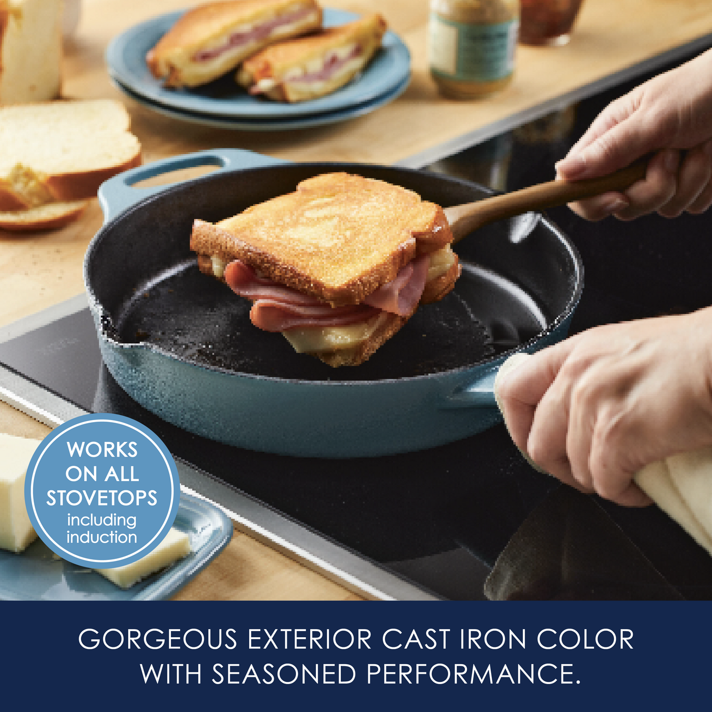 Someone cooking a sandwich in a blue cast iron skillet on a stovetop.