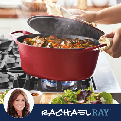 A person lifting a lid off a red pot on a stove.