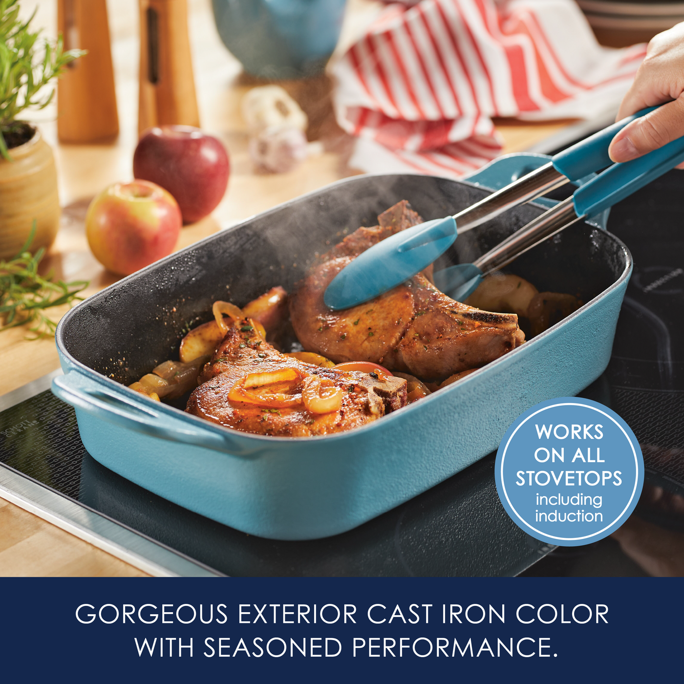 Cooking pork chops in a blue cast iron pan on a stovetop.
