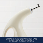 Close-up of a ceramic soap dispenser with a pump.