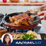 Person cooking a seasoned whole chicken in a skillet with herbs and lemon.