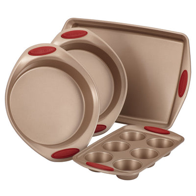 Non-stick bakeware set with two round pans, one tray, and a muffin tin.