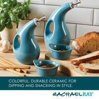 The EVOO Bottle and Ramekin Dipper Set sits gracefully on the table alongside fresh bread and herbs. This charming ceramic set is not only stylish but also dishwasher safe, making cleanup a breeze.
