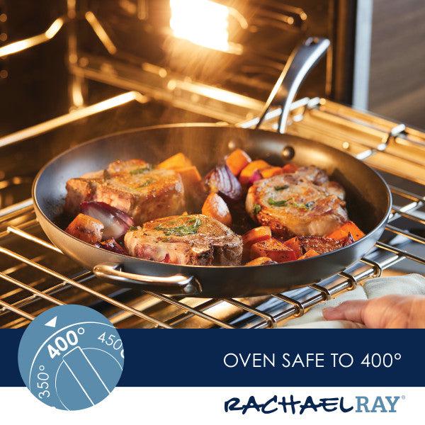 Featuring a skillet with meat and vegetables in an oven, the Cook + Create Hard Anodized Nonstick Frying Pan is designed for durability with its hard-anodized aluminum construction. Branded as oven safe at temperatures up to 400°F, this frying pan ensures your culinary creations cook to perfection.