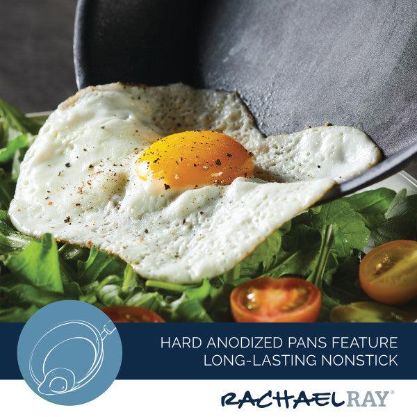 A fried egg sizzles in the 4-Quart Professional Hard Anodized Nonstick Saucier with Lid, surrounded by fresh greens and juicy tomatoes, showcasing the magic of high-quality, dishwasher-safe cookware.