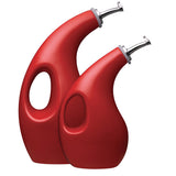 Two red, curvy oil dispensers with handles and metal spouts.