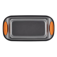 9-Inch x 5-Inch Nonstick Loaf/Meatloaf pan featuring orange silicone handles, made from heavy gauge steel for durability, shown from a top view.