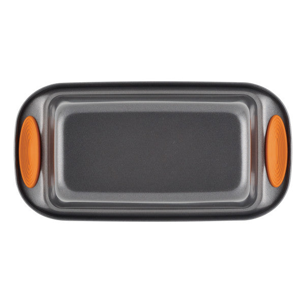 9-Inch x 5-Inch Nonstick Loaf/Meatloaf pan featuring orange silicone handles, made from heavy gauge steel for durability, shown from a top view.