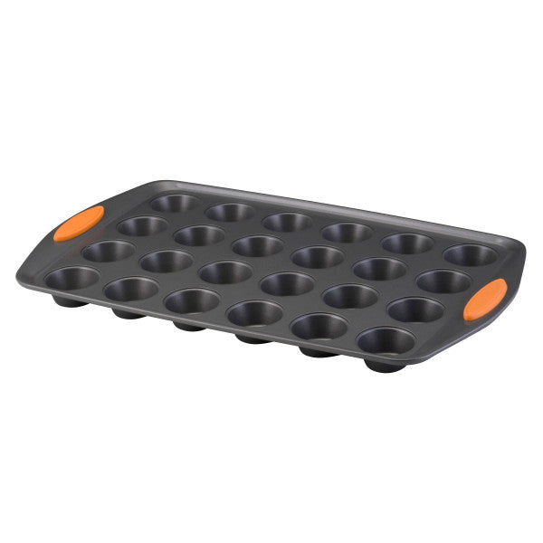 24-Cup Nonstick Mini Muffin Pan with orange handles, designed for use in the oven.
