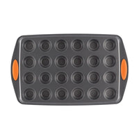 24-Cup Nonstick Mini Muffin Pan featuring orange side grips, designed to be oven safe for all your baking needs.
