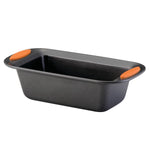 Black loaf pan with orange handles.