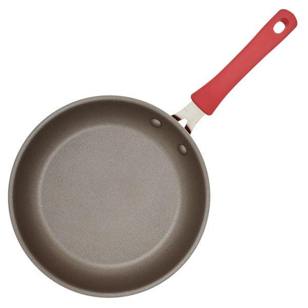 Cook + Create Nonstick Frying Pan with a red handle, made from thicker gauge aluminum, viewed from above.