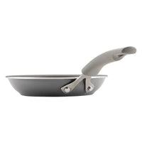 Cook + Create Nonstick Frying Pan in gray with a side view, featuring a curved handle and made from thicker gauge aluminum for high-performance cooking.