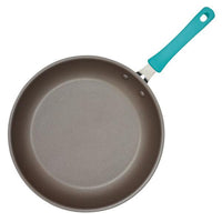 The Cook + Create Nonstick Frying Pan boasts a teal handle and is crafted with thicker gauge aluminum for enhanced durability and high performance.