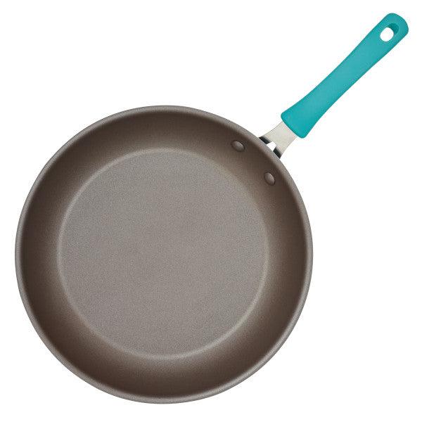The Cook + Create Nonstick Frying Pan boasts a teal handle and is crafted with thicker gauge aluminum for enhanced durability and high performance.