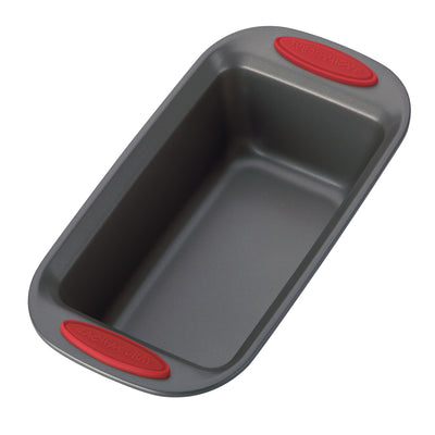 A non-stick loaf pan with red silicone grips on both handles.