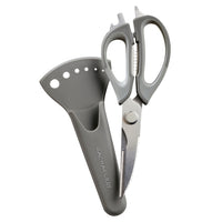 Gray kitchen scissors with a protective sheath.