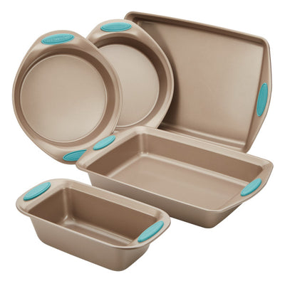 Five beige baking pans with blue handles in various shapes and sizes.