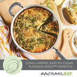 Frittata in a nonstick pan with a slice cut out, wooden spatula beside it.