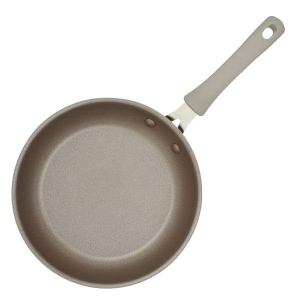 The Cook + Create Nonstick Frying Pan is made from a thicker gauge aluminum and includes a light gray handle and interior for high-performance cooking.