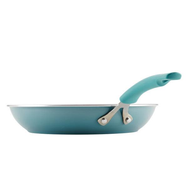 Side view of a Cook + Create Nonstick Frying Pan featuring a high-performance teal design with a matching handle, crafted from thicker gauge aluminum for enhanced durability.