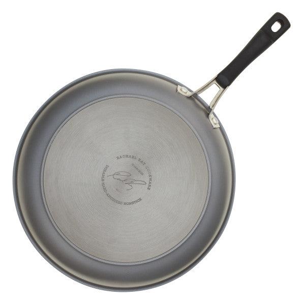 The Cook + Create Hard Anodized Nonstick Frying Pan, gray in color with a black handle, is viewed from above and showcases a triple-layer nonstick surface for easy cooking.